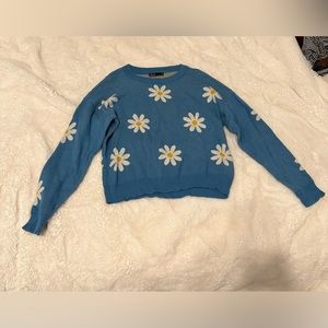 Blue sweater with sunflowers, great condition, and size small.